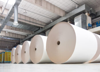 Huge industrial rolls placed in a warehouse