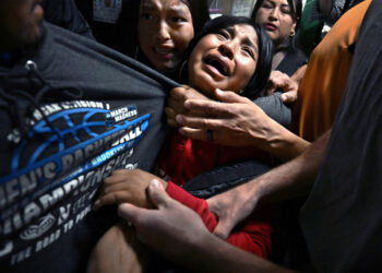 Title: ICE Arrests at New York CourtCredit: © Carol Guzy, ZUMA Press, iWitness, for Miami HeraldCaption: ​​Distraught girls cling to their father, Luis, as ICE detains him following an immigration hearing. Luis served as the sole breadwinner for his family. New York City, New York, United States, 26 August 2025.Story: In 2025, shifts in US immigration policy transformed courthouses into focal points for mass deportation efforts by US Immigration and Customs Enforcement (ICE). Masked ICE agents detained undocumented migrants immediately following their hearings, often leading to deeply traumatic family separations. These aggressive tactics, coupled with severely overcrowded and unsanitary conditions at the 10th-floor holding facility in the Jacob K. Javits Federal Building in New York, prompted fierce public protests, class-action lawsuits, and the arrest of local elected officials demanding accountability.